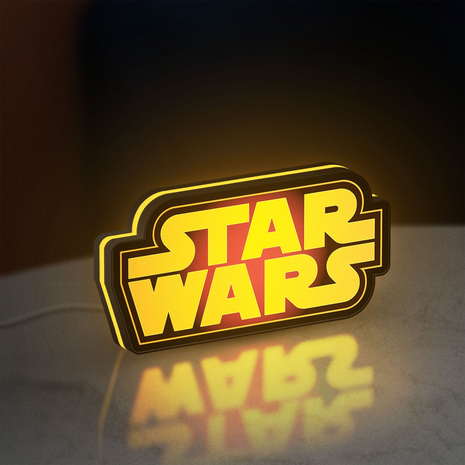 Star Wars LED lightbox standing on a desk from an angled side view with yellow glow