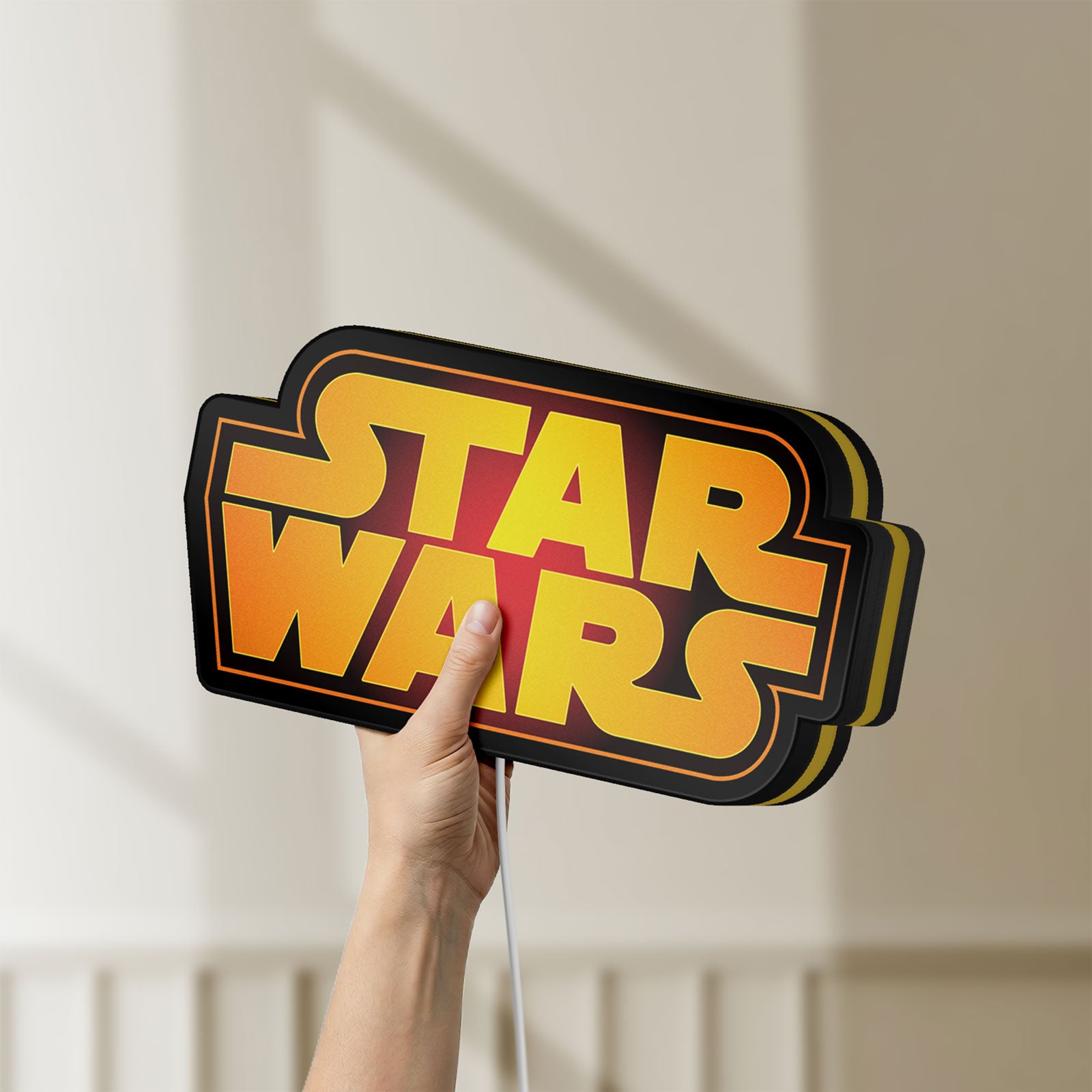 Unlit Star Wars LED lightbox held by hand to show size and details