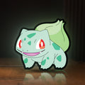 Front view of Bulbasaur LED lightbox sign glowing on a wooden desk