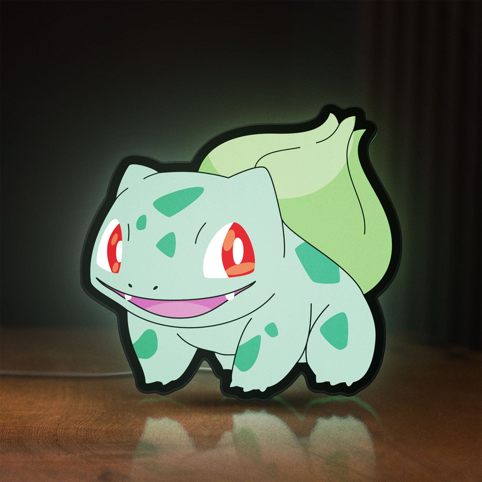 Front view of Bulbasaur LED lightbox sign glowing on a wooden desk