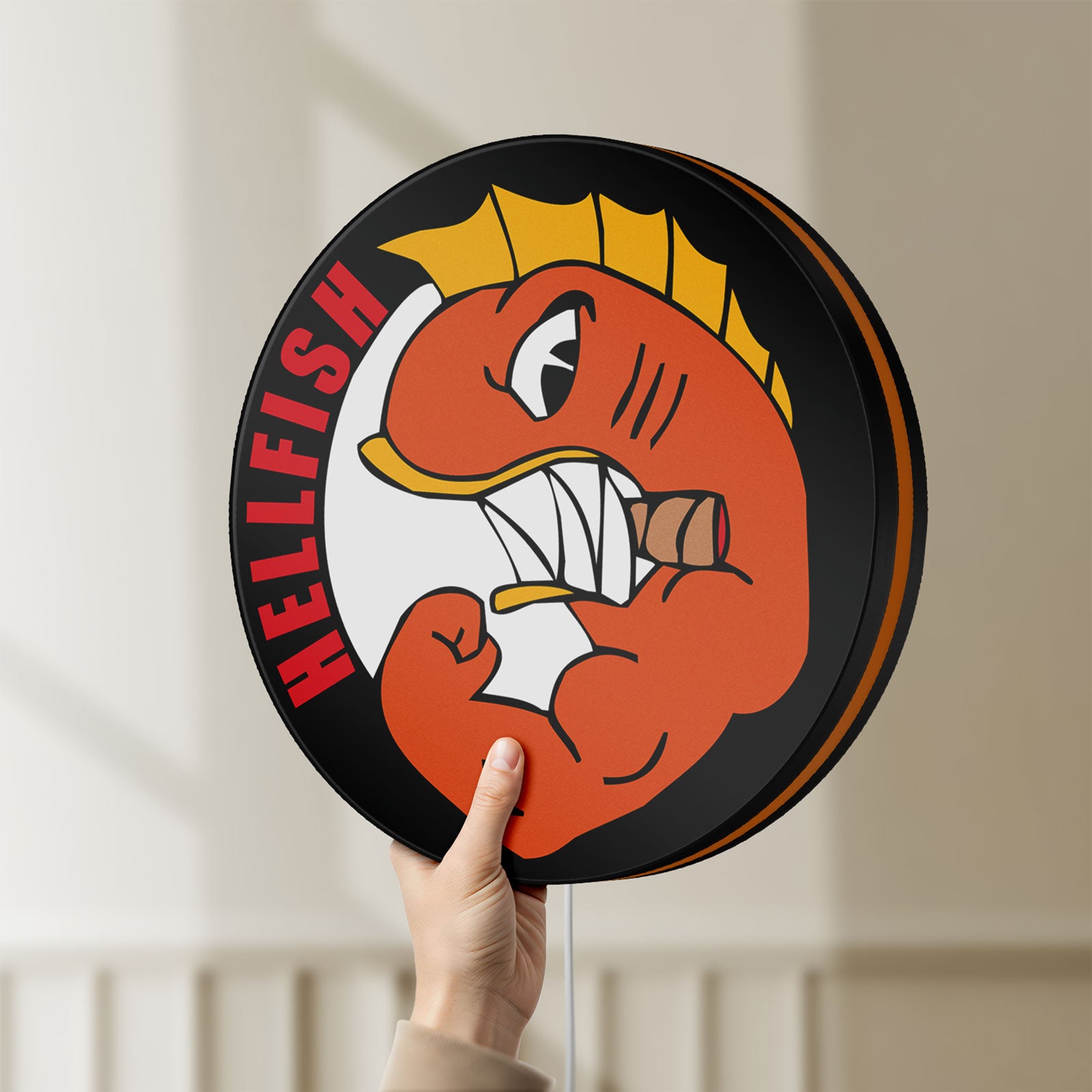 Unlit Hellfish LED lightbox held by hand to show size and details