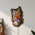 Unlit Goku LED lightbox mounted on a wall in daylight
