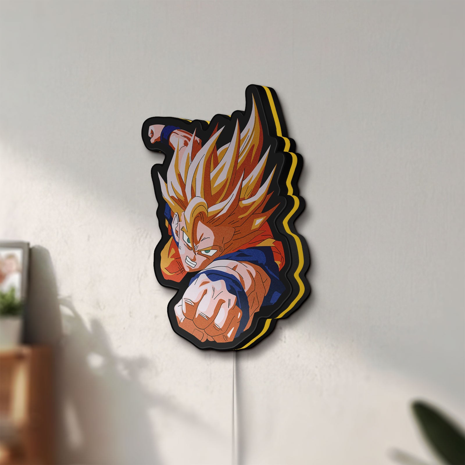 Unlit Goku LED lightbox mounted on a wall in daylight