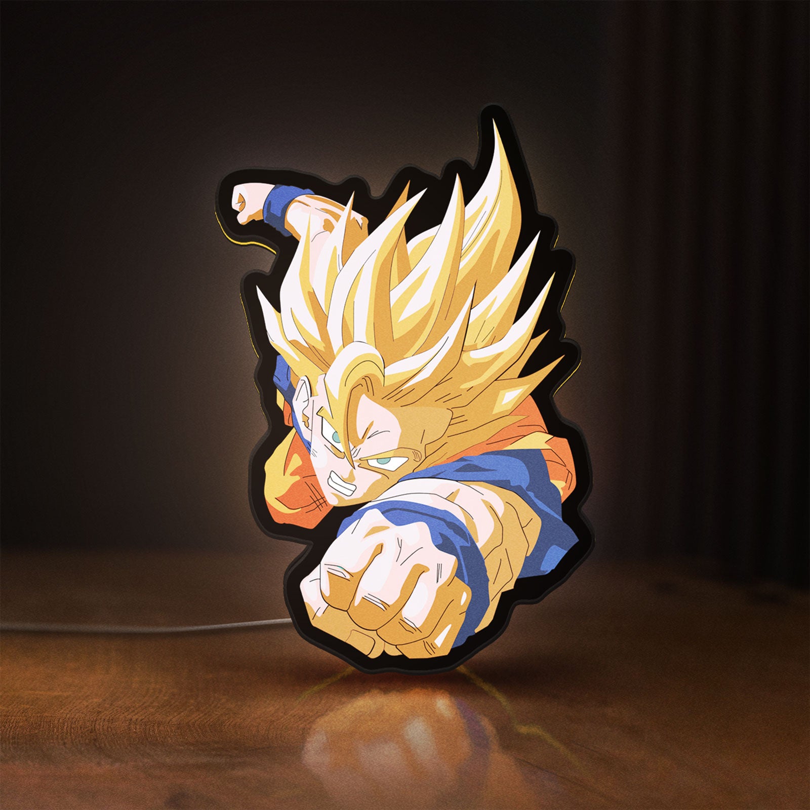 Front view of Goku LED lightbox sign glowing on a wooden desk