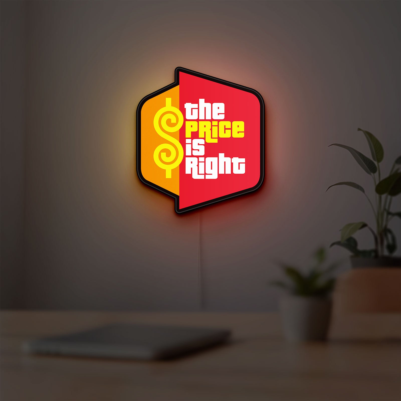 The Price is Right LED lightbox hanging on a room wall with soft red light