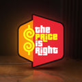 Front view of The Price is Right LED lightbox sign glowing on a wooden desk