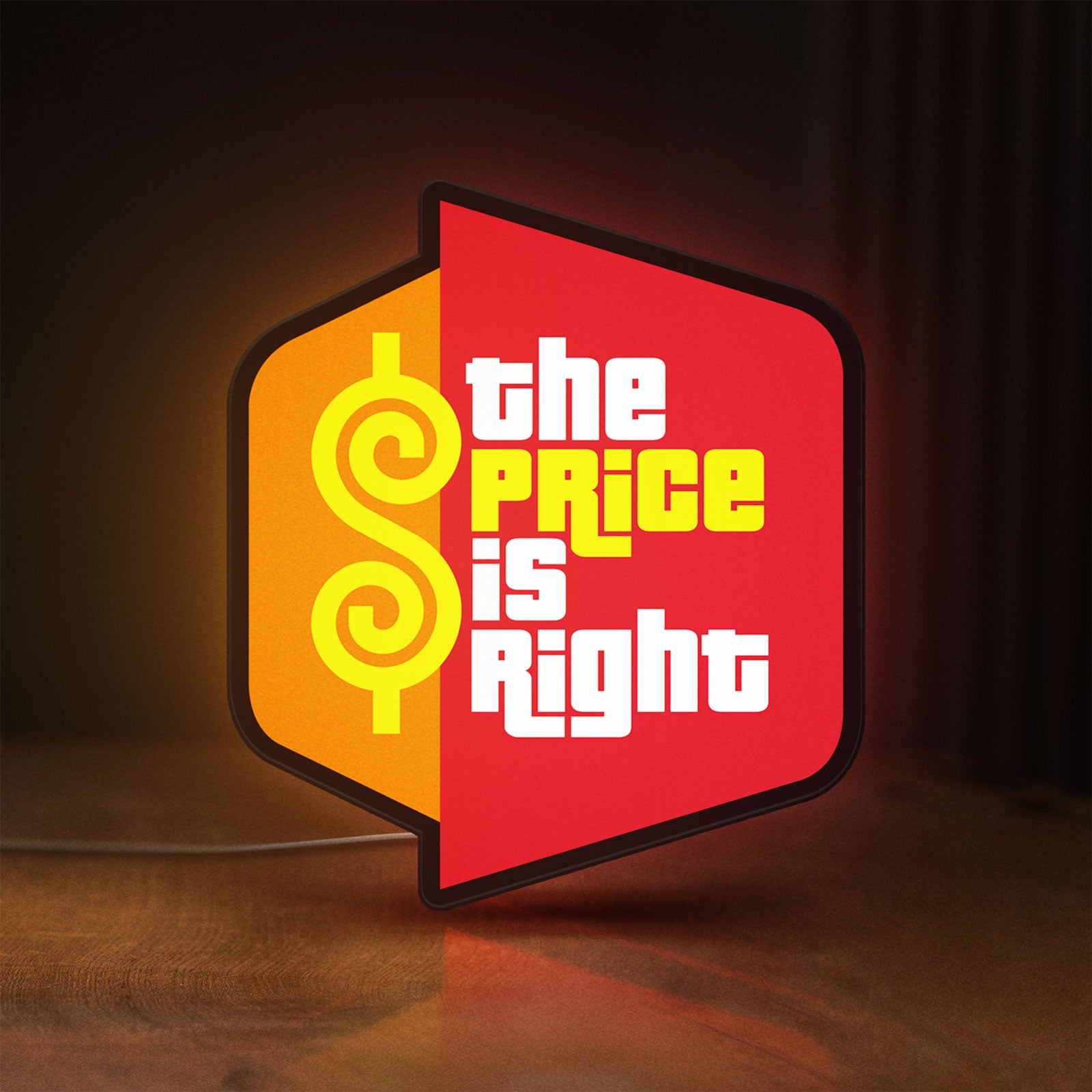 Front view of The Price is Right LED lightbox sign glowing on a wooden desk
