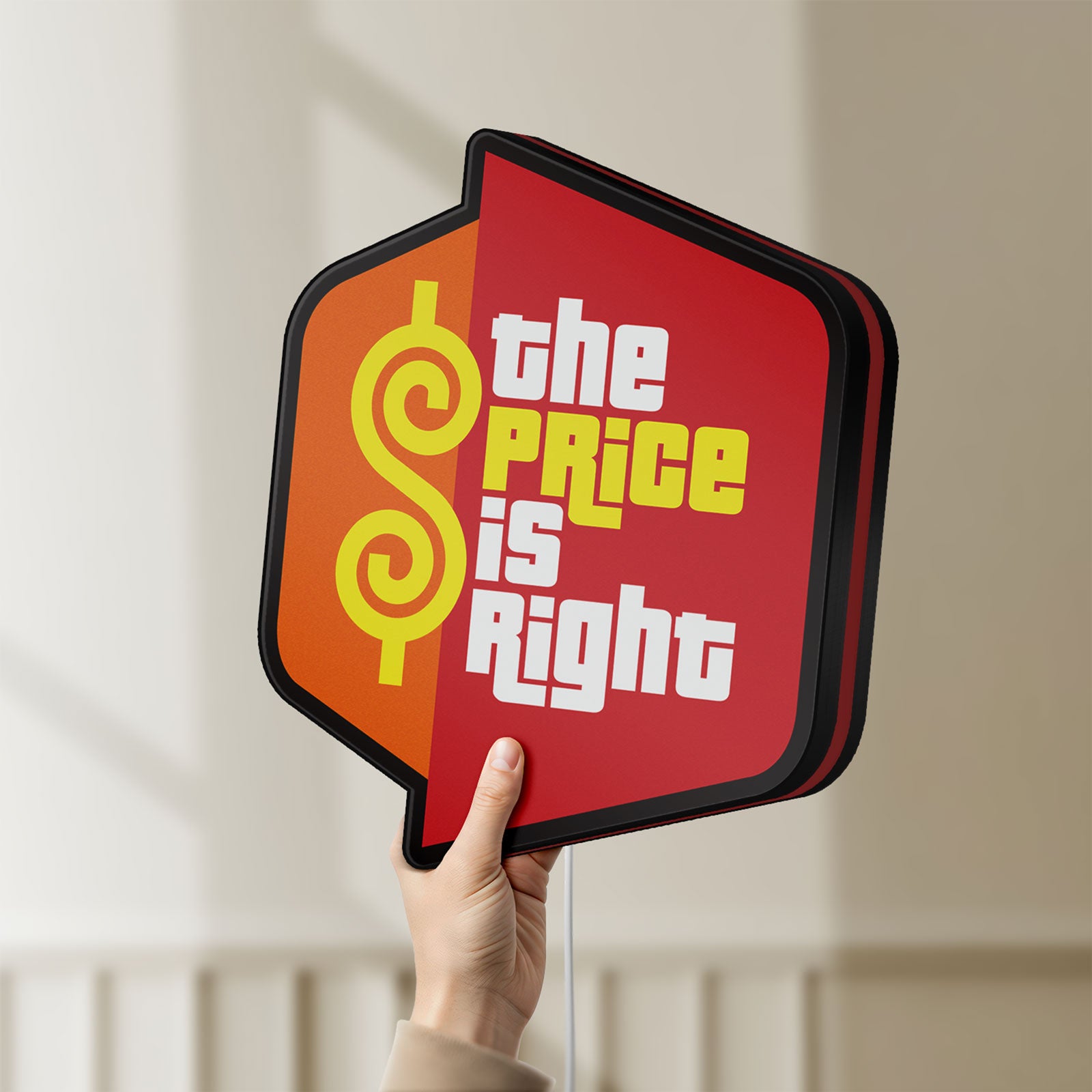 Unlit The Price is Right LED lightbox held by hand to show size and details