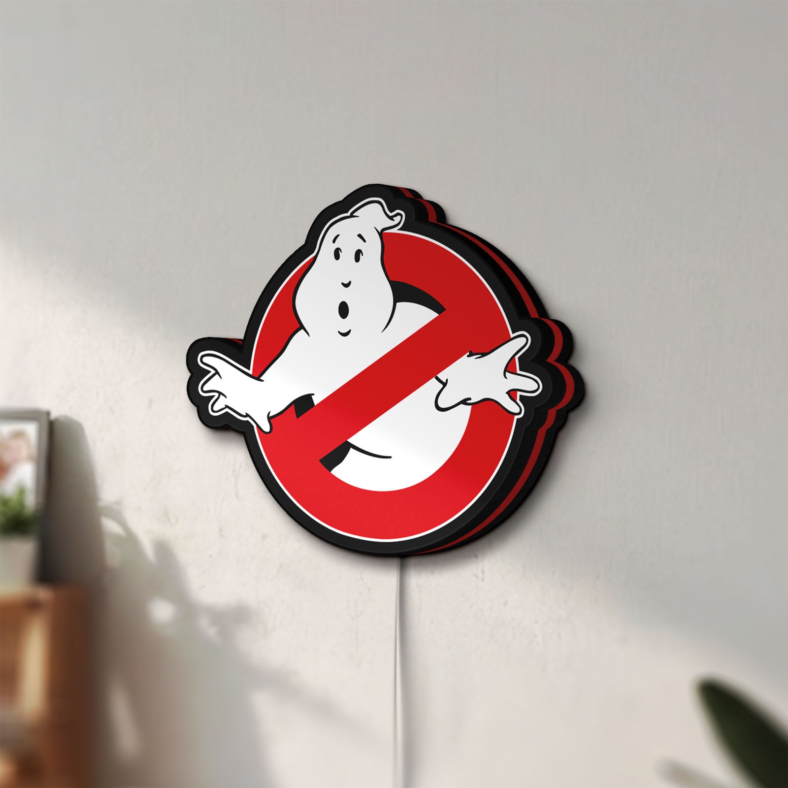Unlit Ghostbusters LED lightbox mounted on a wall in daylight