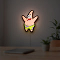 Patrick Star LED lightbox hanging on a room wall with soft white light