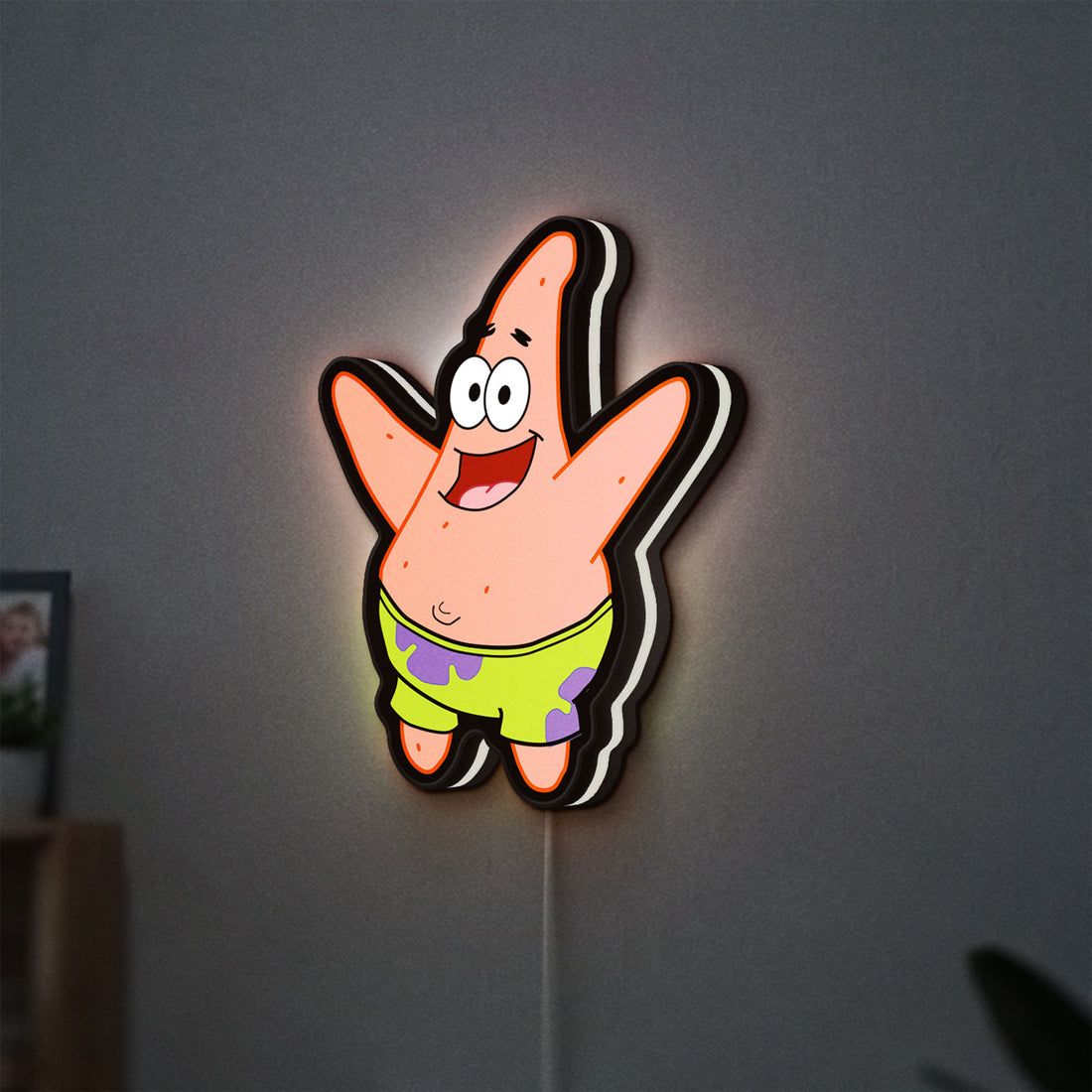 Patrick Star LED lightbox hanging on a wall with white glow