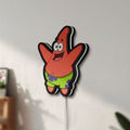Unlit Patrick Star LED lightbox mounted on a wall in daylight