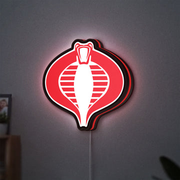 G.I. Joe Cobra LED lightbox hanging on a wall with red glow