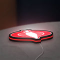 G.I. Joe Cobra LED lightbox lying flat on a desk with red glow