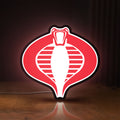 Front view of G.I. Joe Cobra LED lightbox sign glowing on a wooden desk