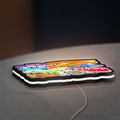 Disney's Cars Characters LED lightbox lying flat on a desk with white glow