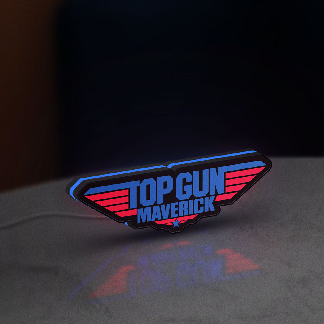 Top Gun Maverick LED lightbox hanging on a wall with blue glow
