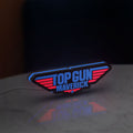 Top Gun Maverick LED lightbox standing on a desk from an angled side view with blue glow