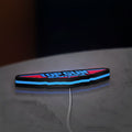 Top Gun Maverick LED lightbox lying flat on a desk with blue glow