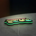Teenage Mutant Ninja Turtles LED lightbox lying flat on a desk with green glow