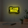 Clone Wars LED lightbox hanging on a room wall with soft yellow light