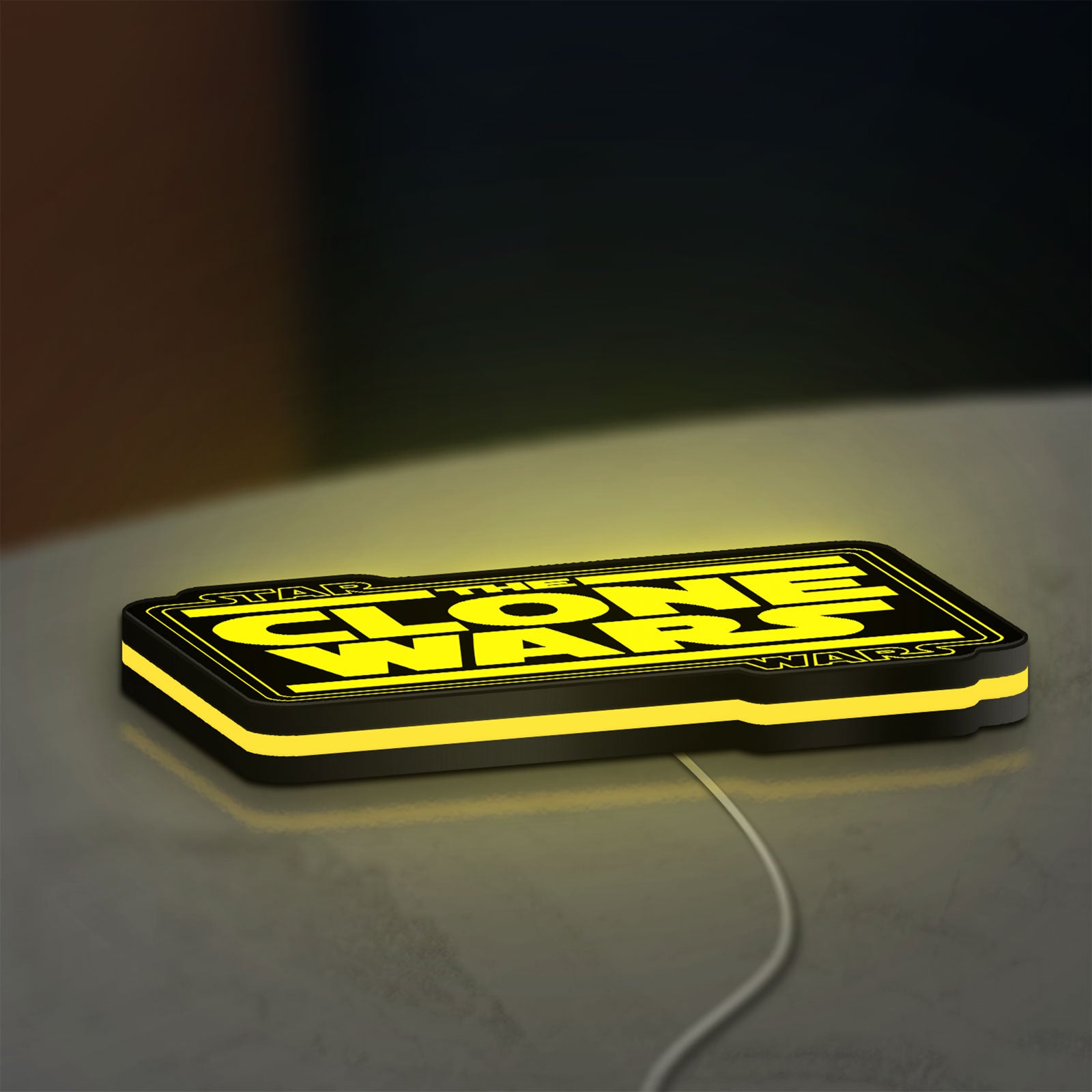 Clone Wars LED lightbox lying flat on a desk with yellow glow