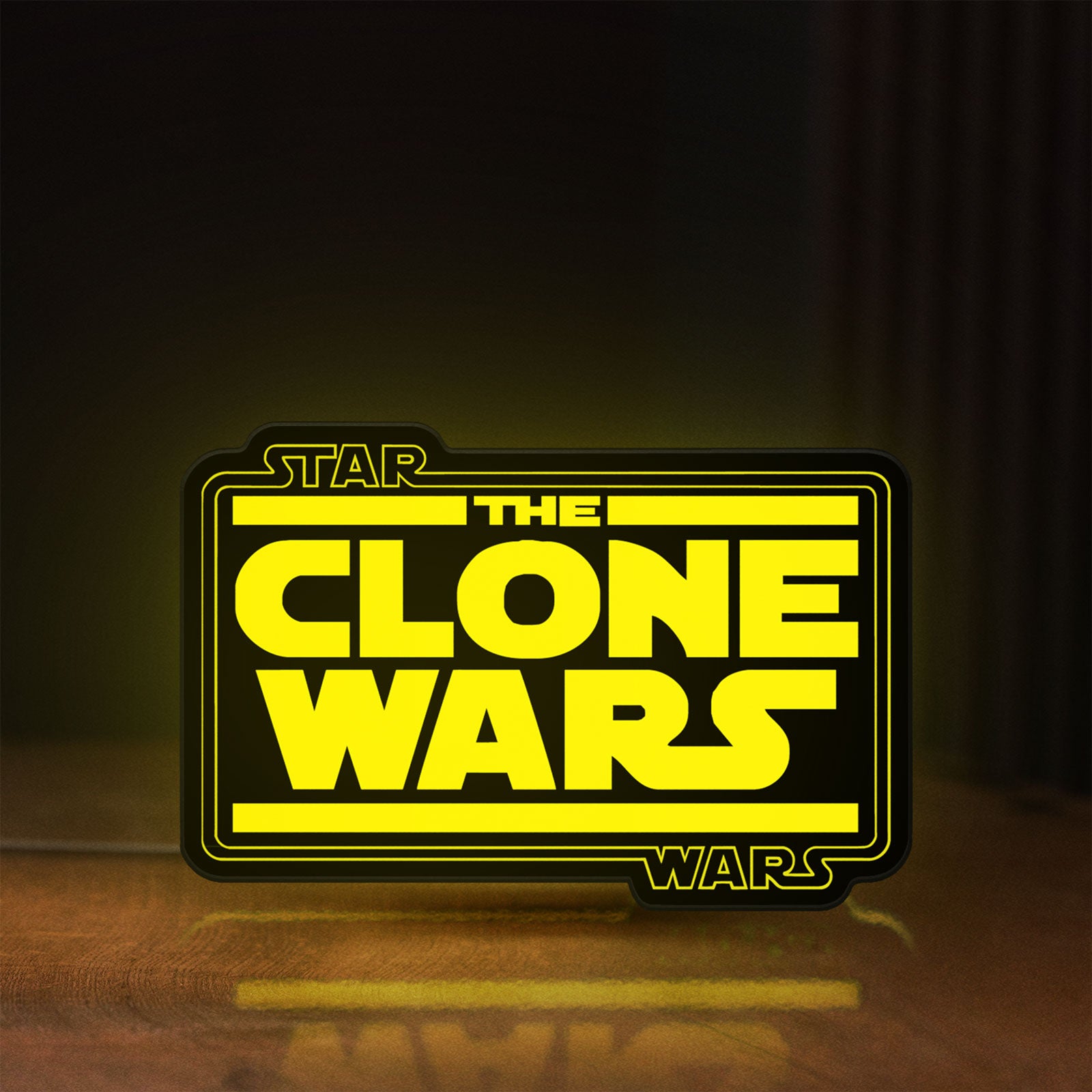 Front view of Clone Wars LED lightbox sign glowing on a wooden desk