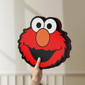 Unlit Elmo LED lightbox held by hand to show size and details