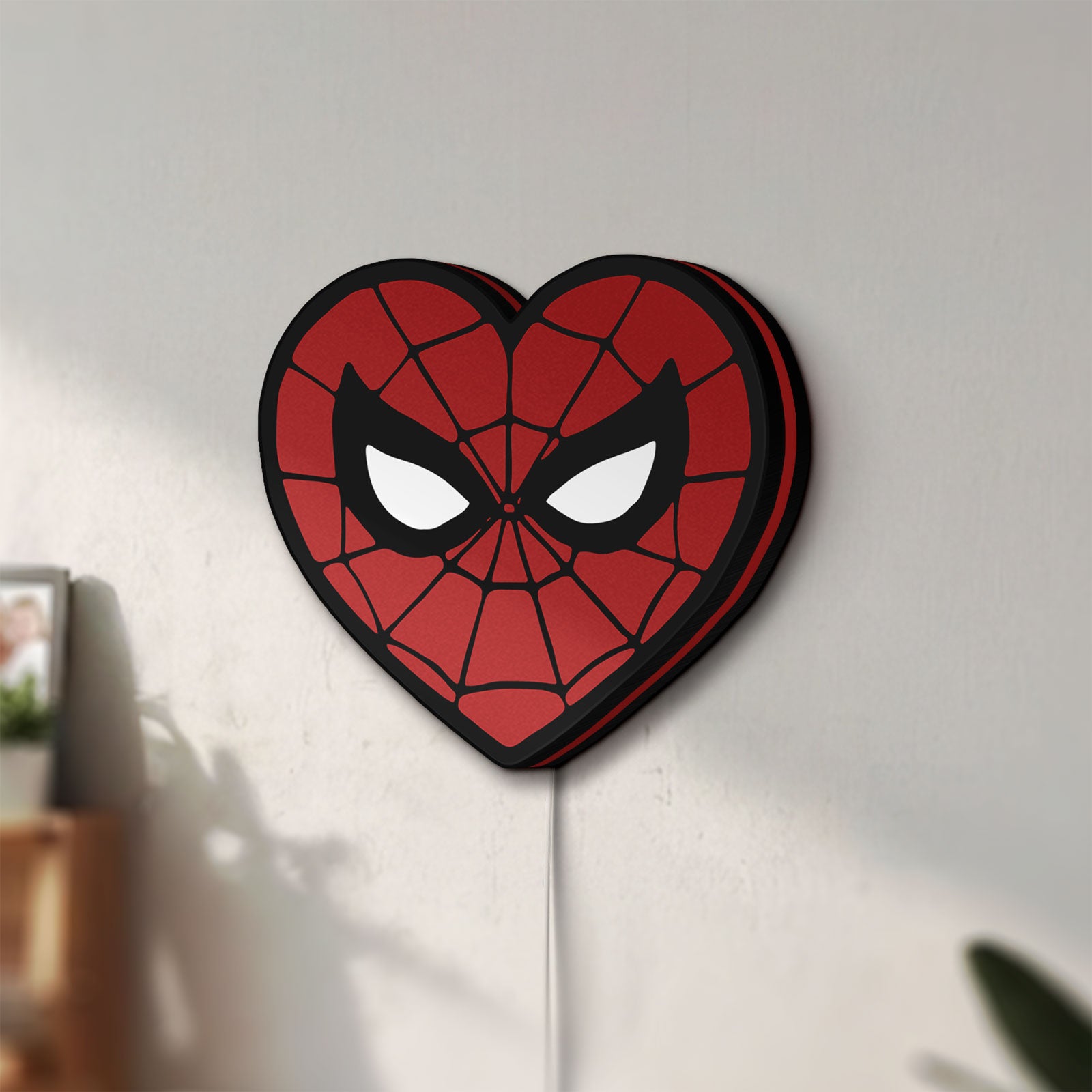 Unlit Spiderman Heart LED lightbox mounted on a wall in daylight