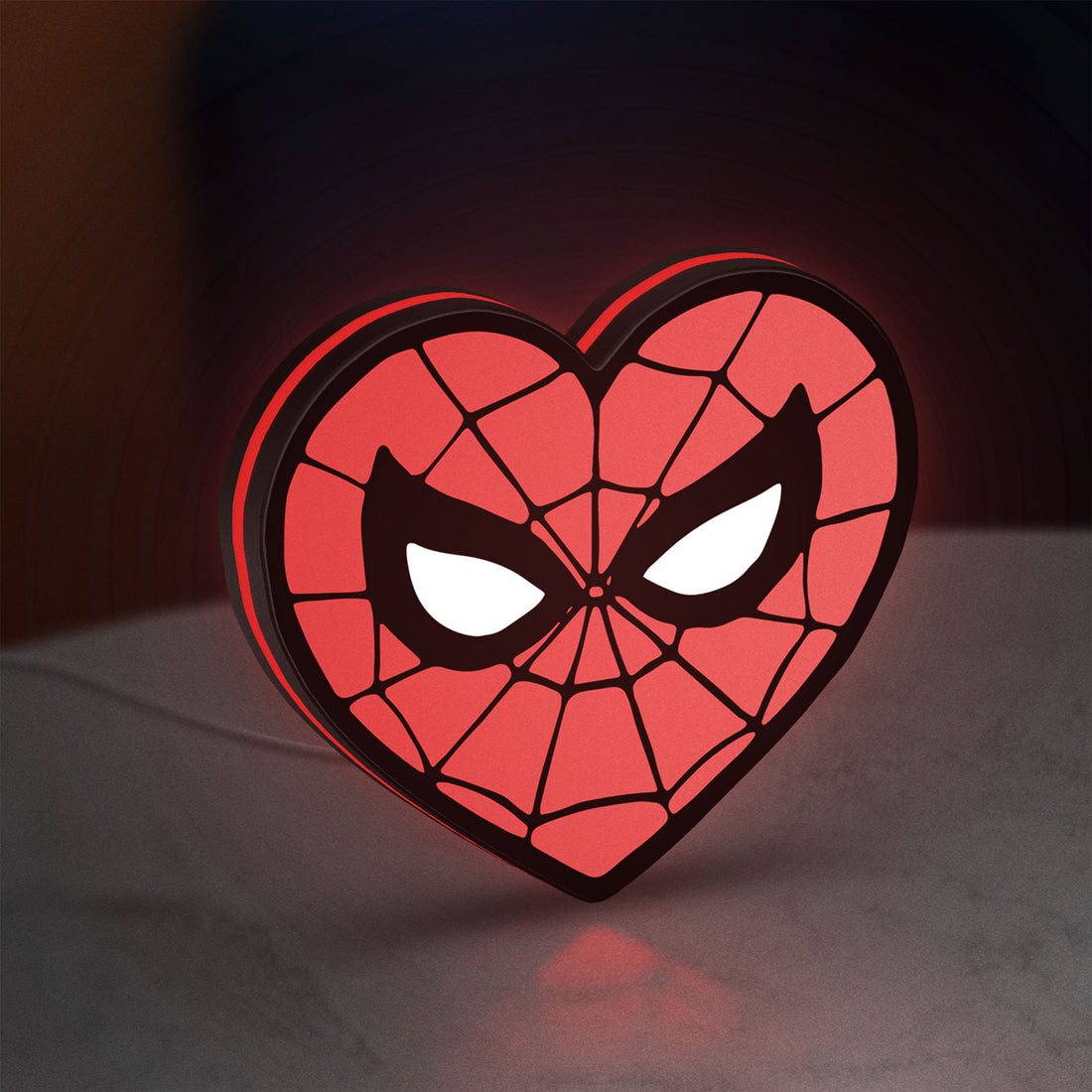 Spiderman Heart LED lightbox hanging on a wall with red glow
