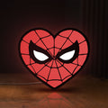 Front view of Spiderman Heart LED lightbox sign glowing on a wooden desk