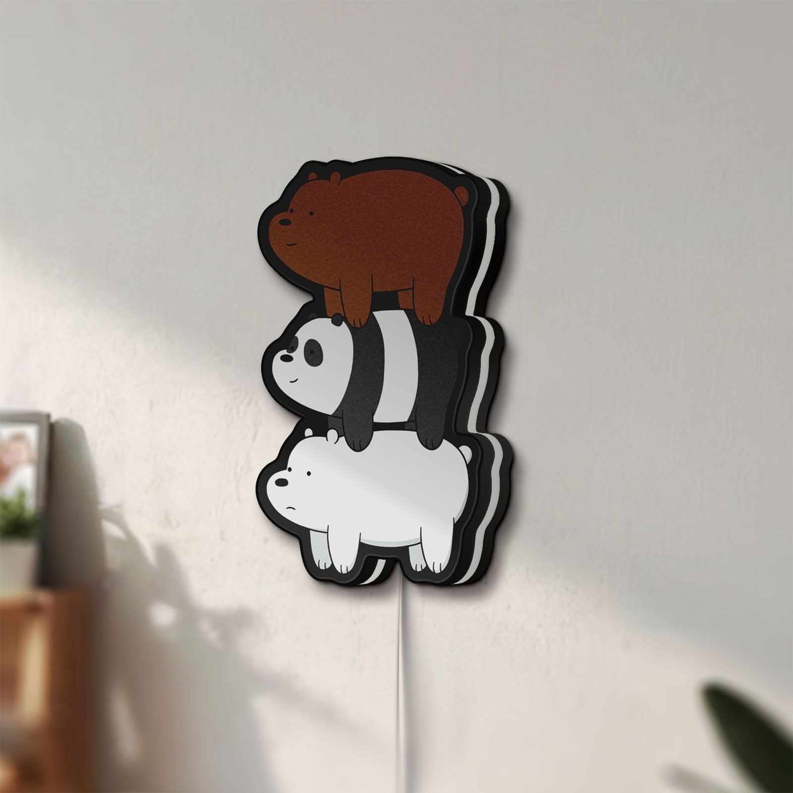 Unlit We Bare Bears Stacked Bears LED lightbox mounted on a wall in daylight