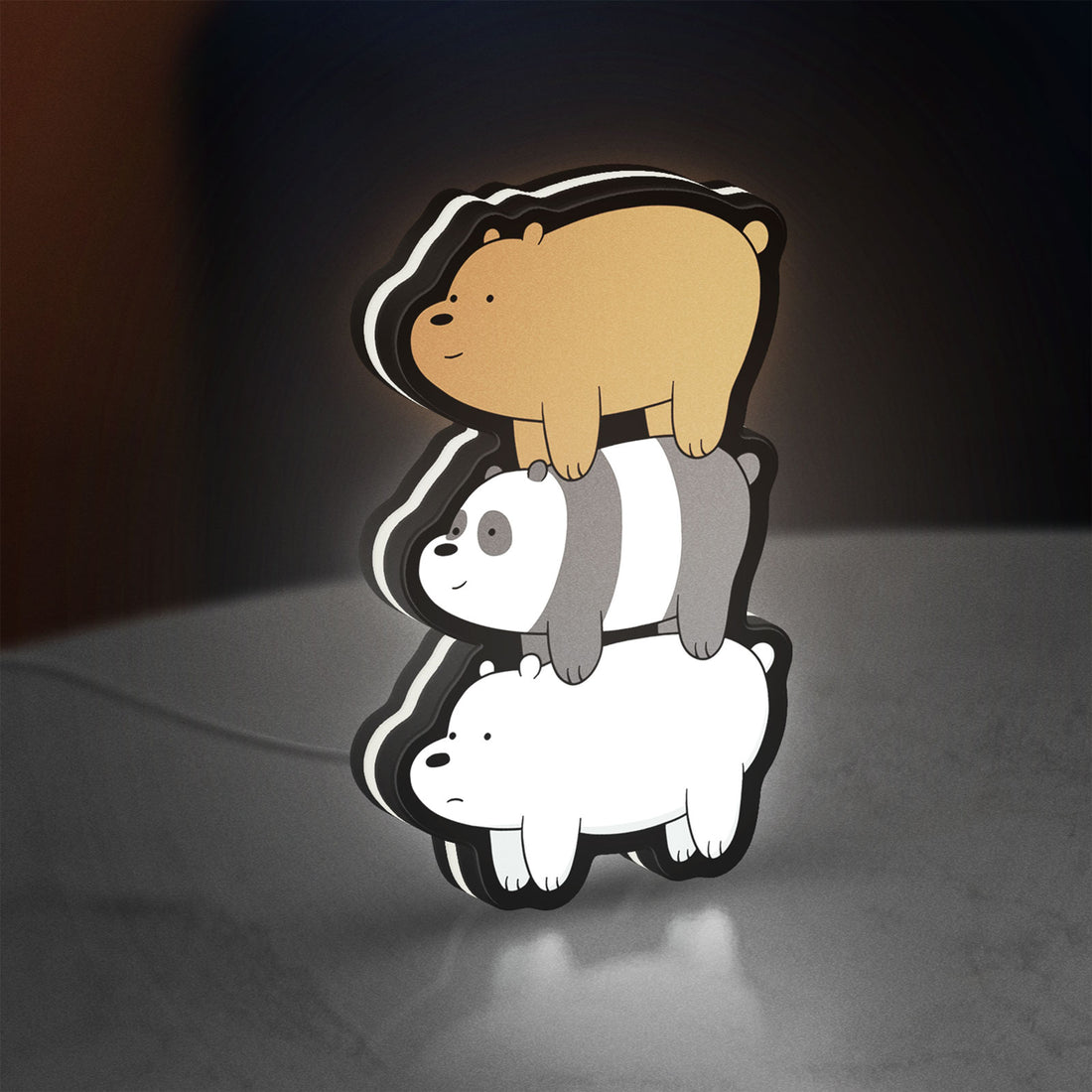 We Bare Bears Stacked Bears LED lightbox hanging on a wall with white glow