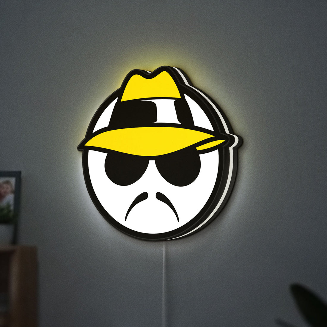 Lowrider LED lightbox hanging on a wall with white glow