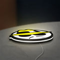 Lowrider LED lightbox lying flat on a desk with white glow