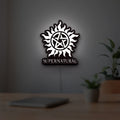 Supernatural LED lightbox hanging on a room wall with soft white light