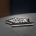 Supernatural LED lightbox lying flat on a desk with white glow