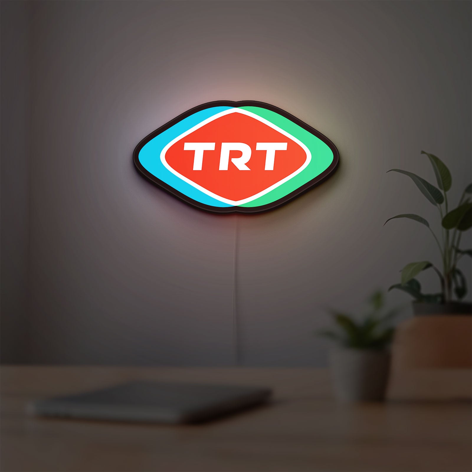 TRT LED lightbox hanging on a room wall with soft white light