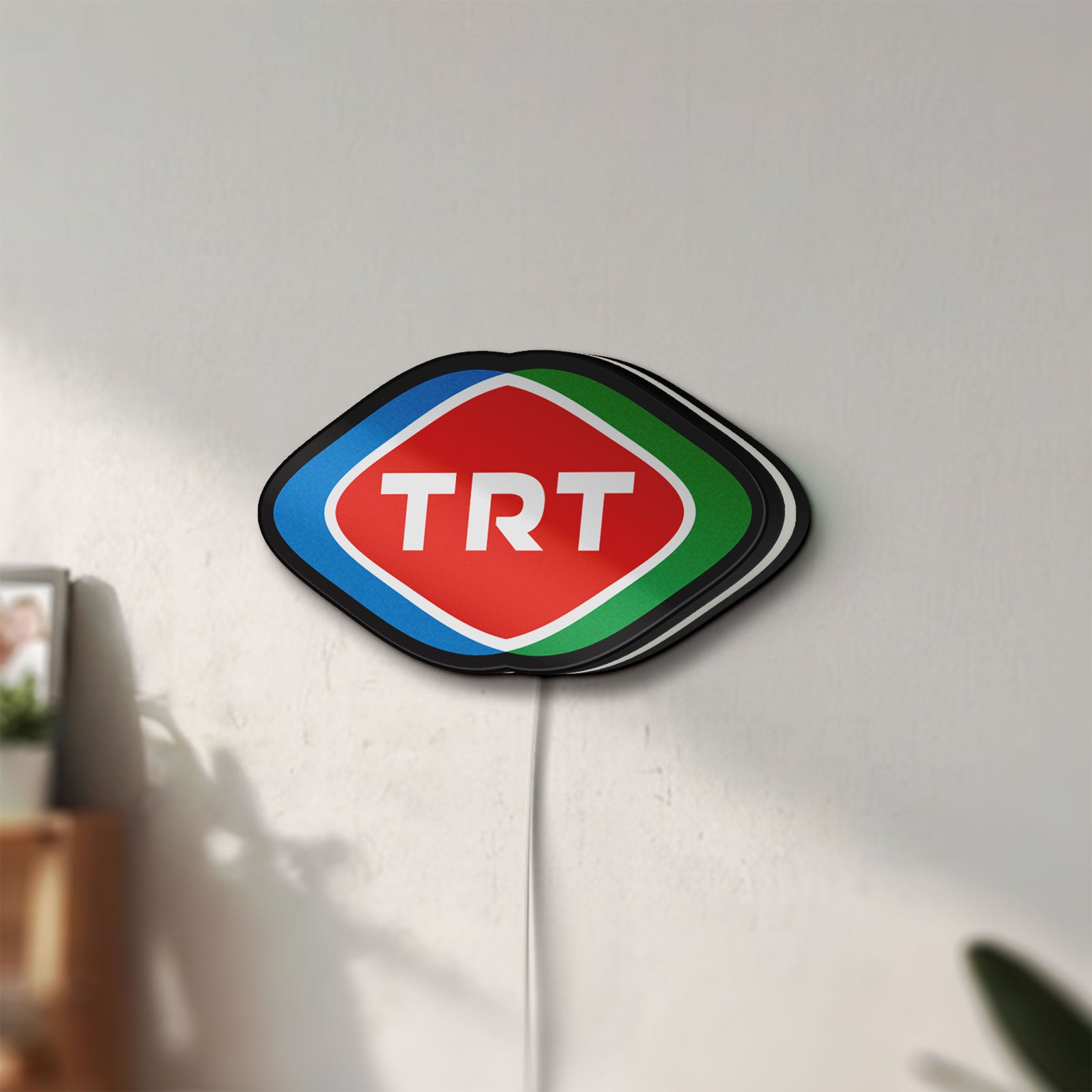 Unlit TRT LED lightbox mounted on a wall in daylight