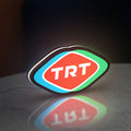 TRT LED lightbox standing on a desk from an angled side view with white glow