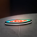 TRT LED lightbox lying flat on a desk with white glow