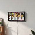 Unlit Stranger Things LED lightbox mounted on a wall in daylight