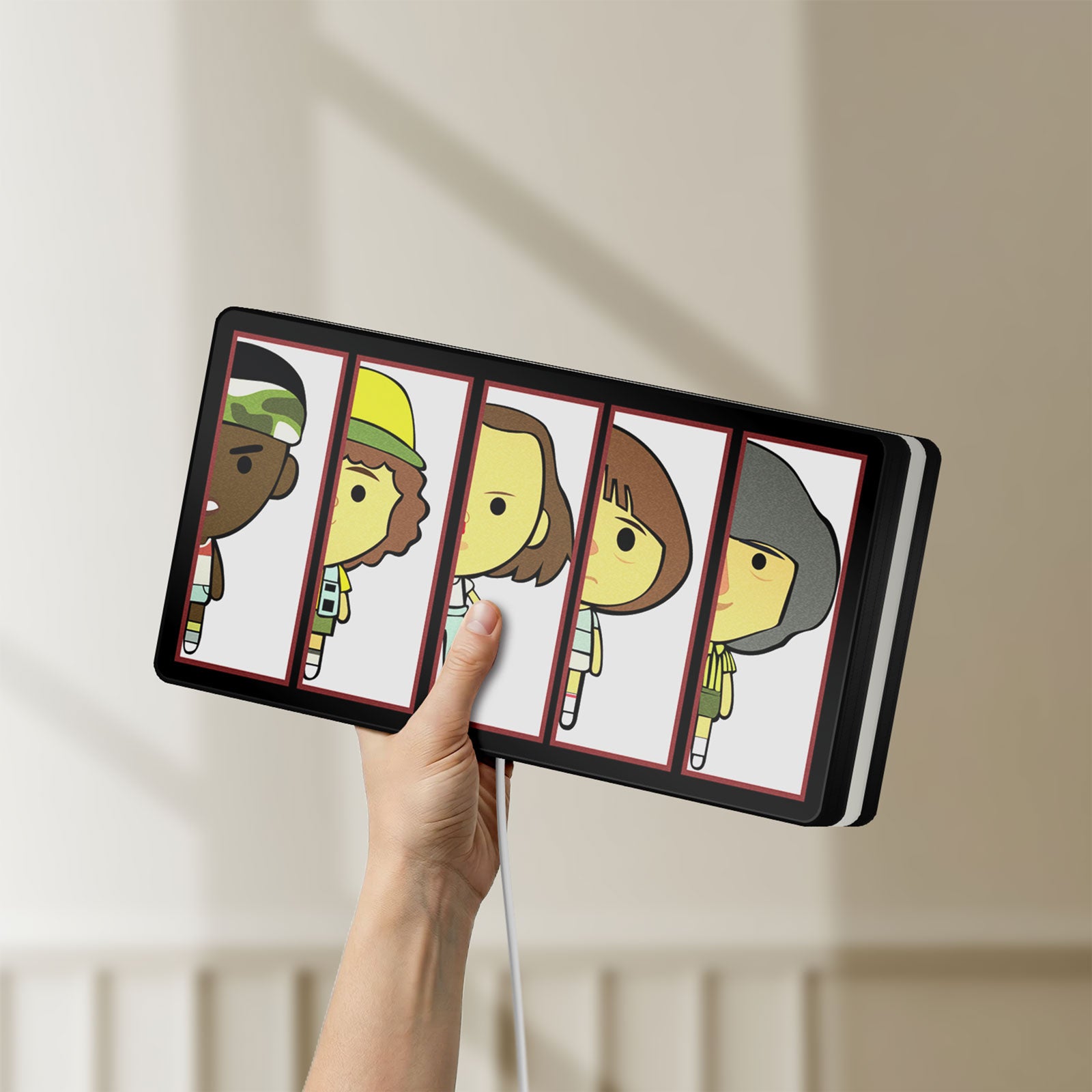 Unlit Stranger Things LED lightbox held by hand to show size and details