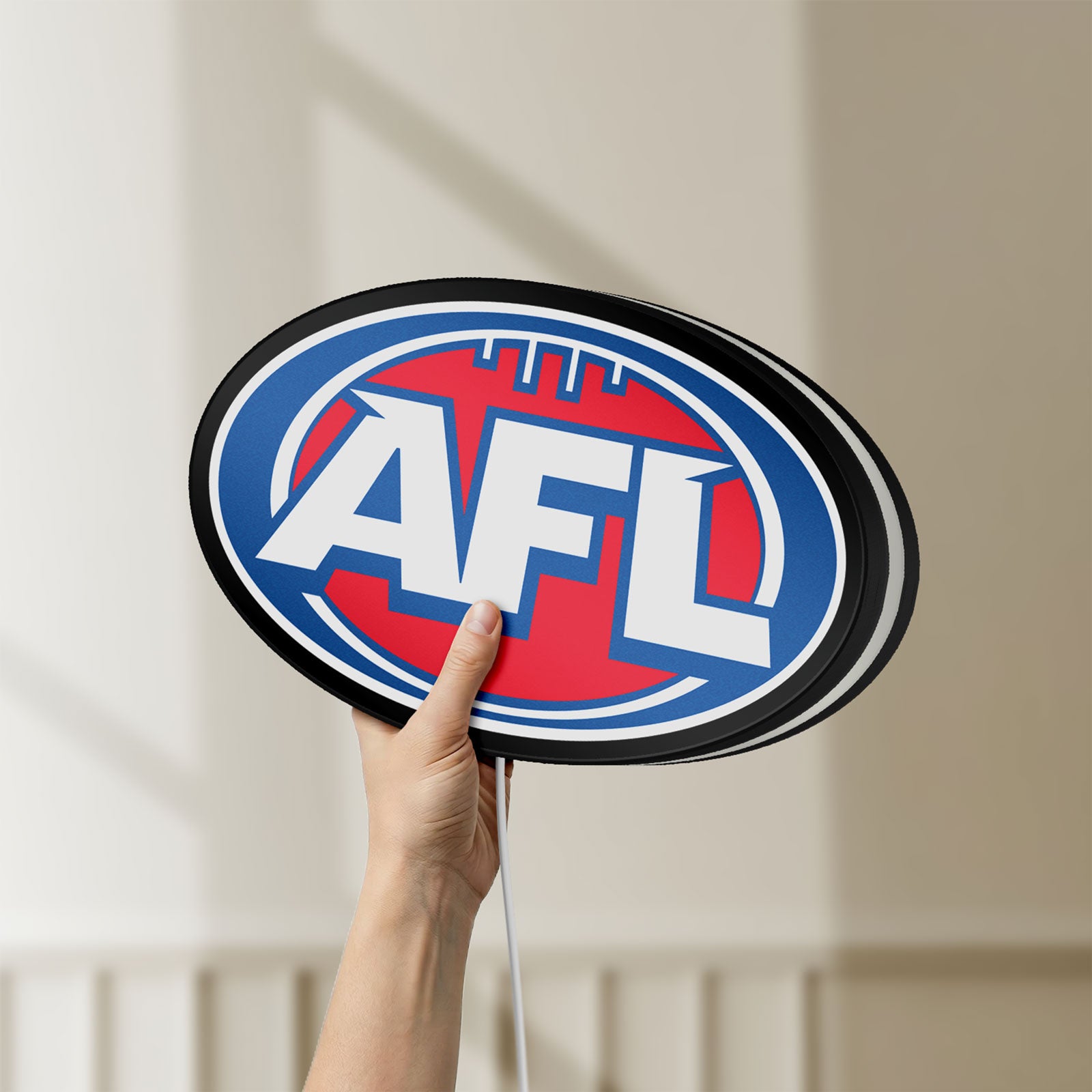 Unlit AFL LED lightbox held by hand to show size and details
