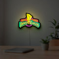 Mighty Morphin Power Rangers LED lightbox hanging on a room wall with soft green light