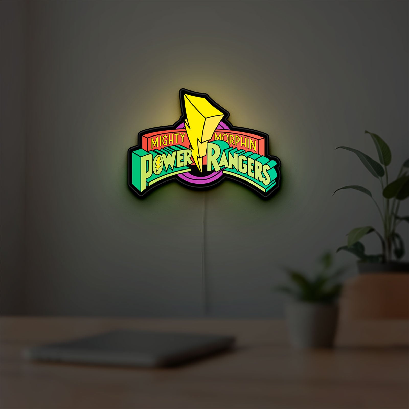 Mighty Morphin Power Rangers LED lightbox hanging on a room wall with soft green light
