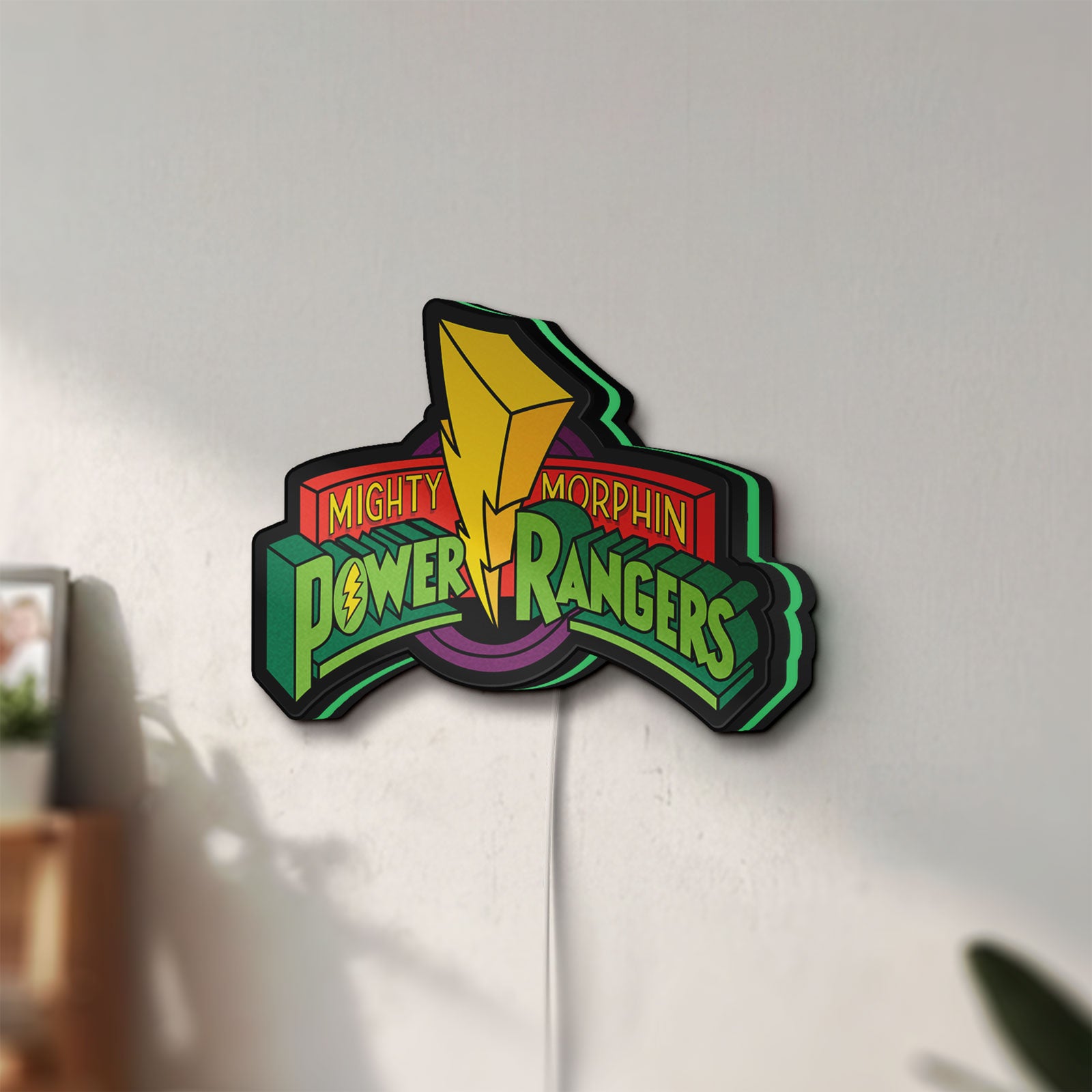 Unlit Mighty Morphin Power Rangers LED lightbox mounted on a wall in daylight