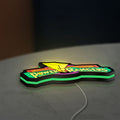 Mighty Morphin Power Rangers LED lightbox lying flat on a desk with green glow
