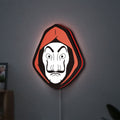 La Casa De Papel LED lightbox hanging on a wall with red glow