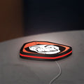 La Casa De Papel LED lightbox lying flat on a desk with red glow